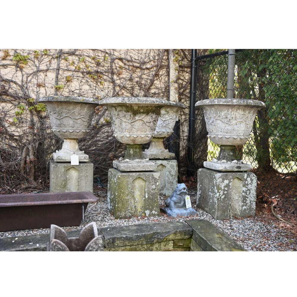 Set of Four Weathered Urns on Bases