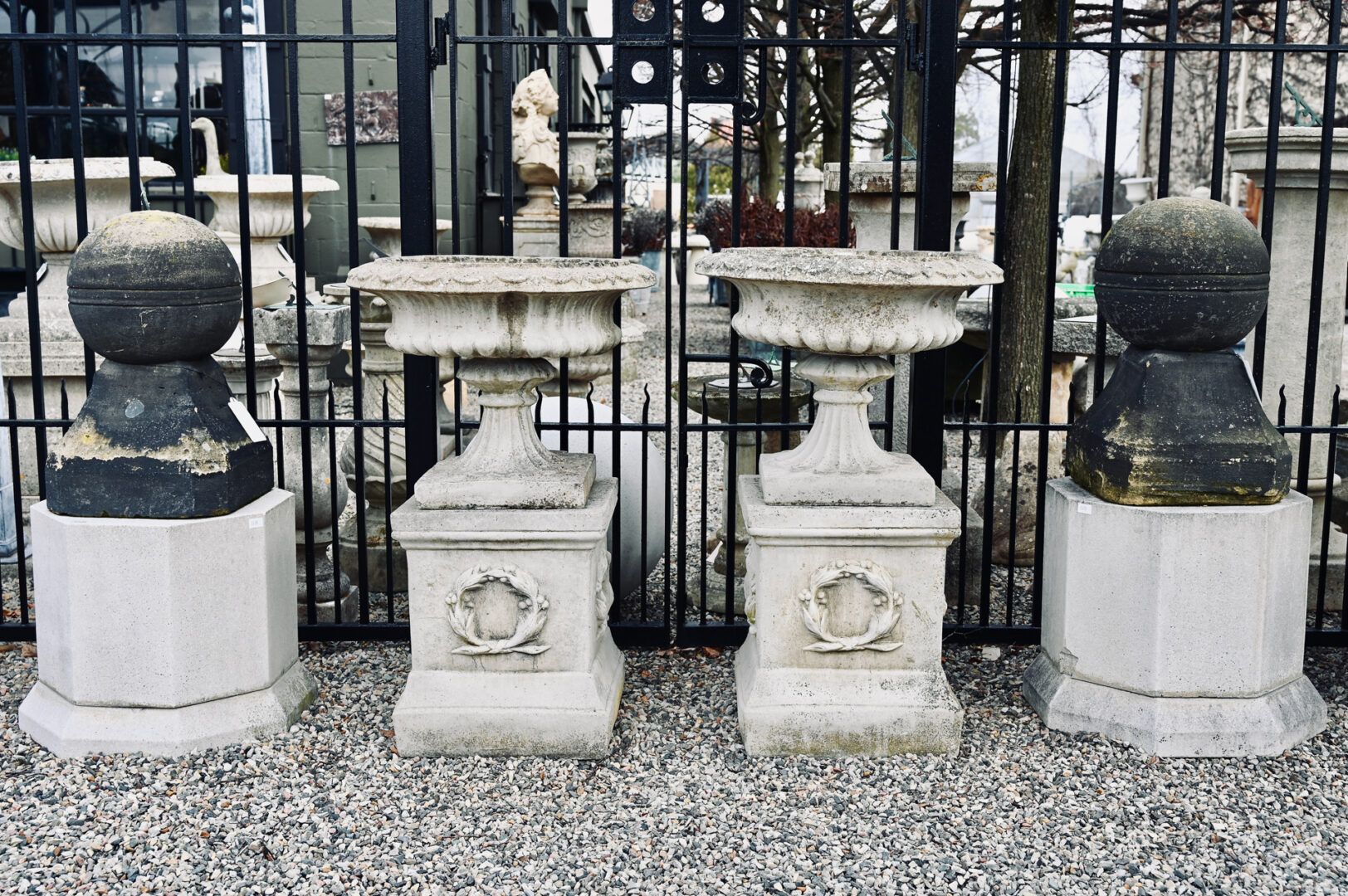 A Pair of Sandford Urns on Pedestals