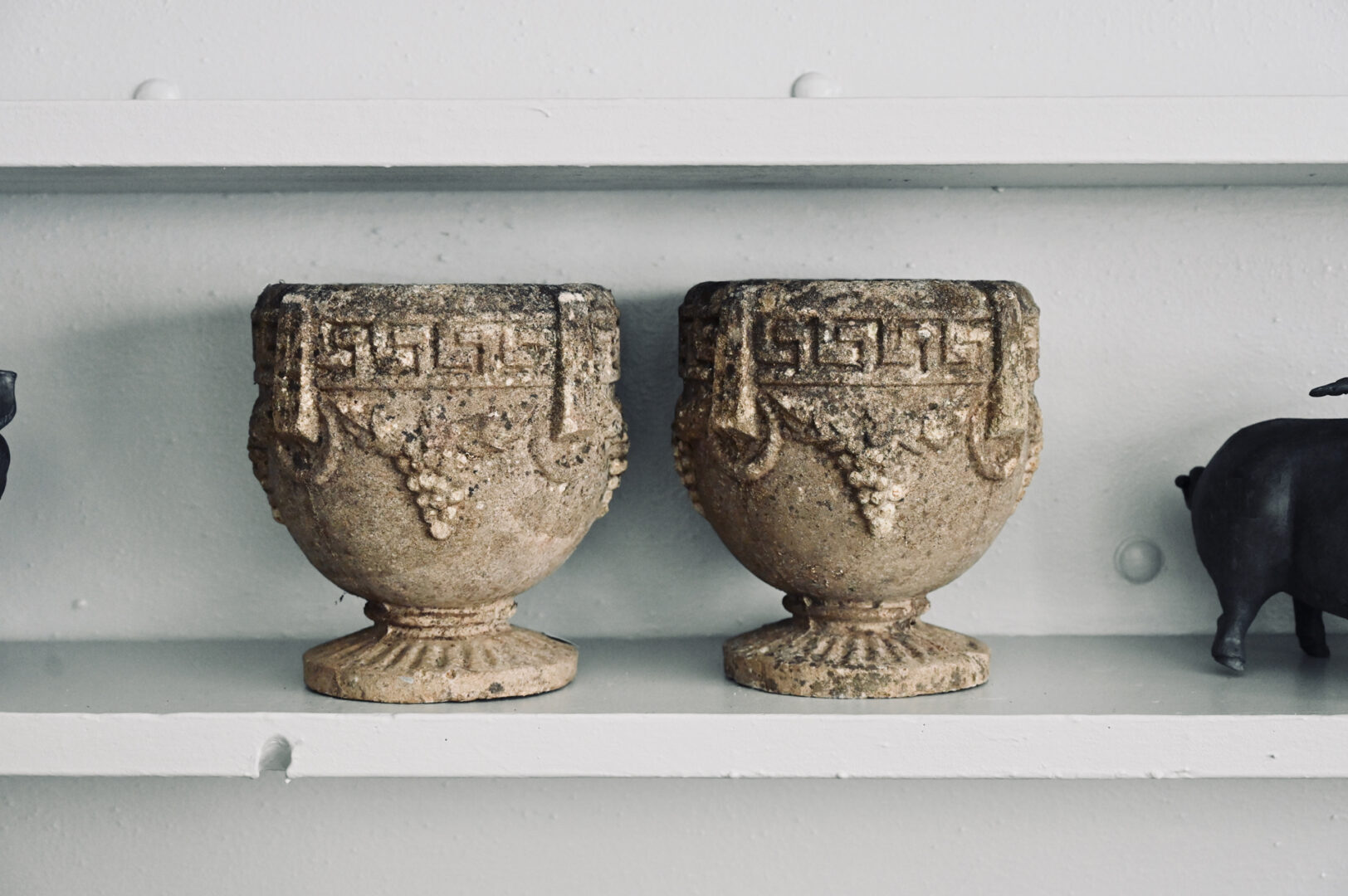 A Pair of Small Grape Urns