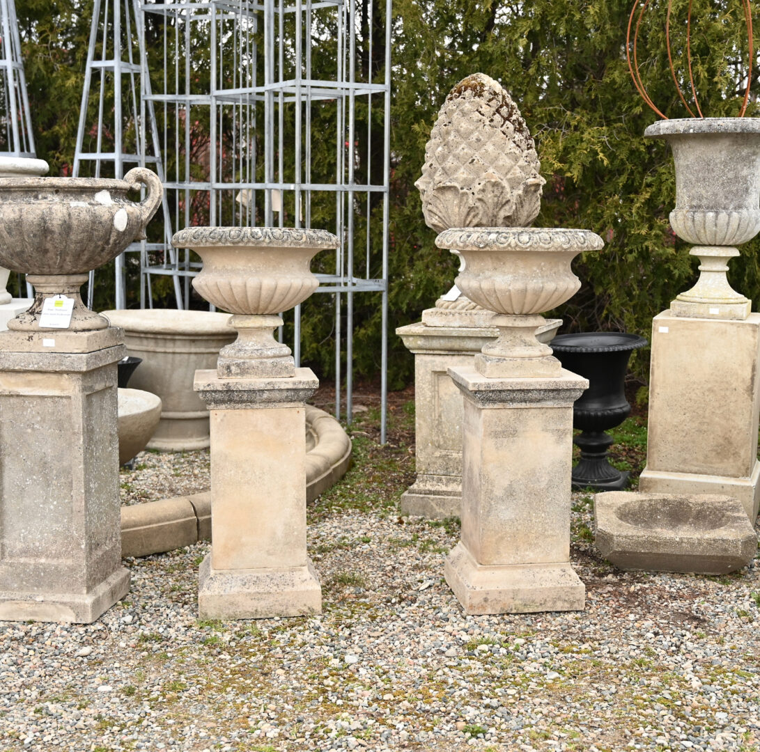 A Pair of English Lobbed Bowl Urns on Pedestals
